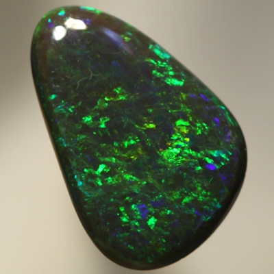 SOLID BLACK OPAL Strong golden fire, top quality.  SEE VIDEO